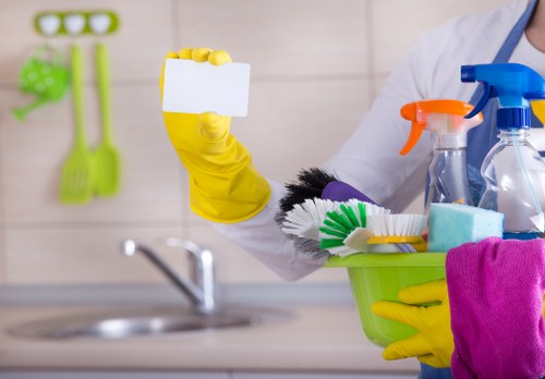 Professional home cleaners in Stockwell working in a modern living room