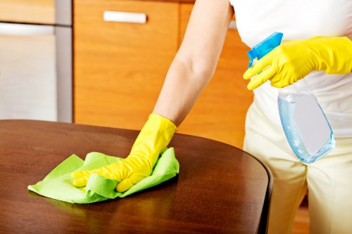Cleaning technician managing equipment and service area safely